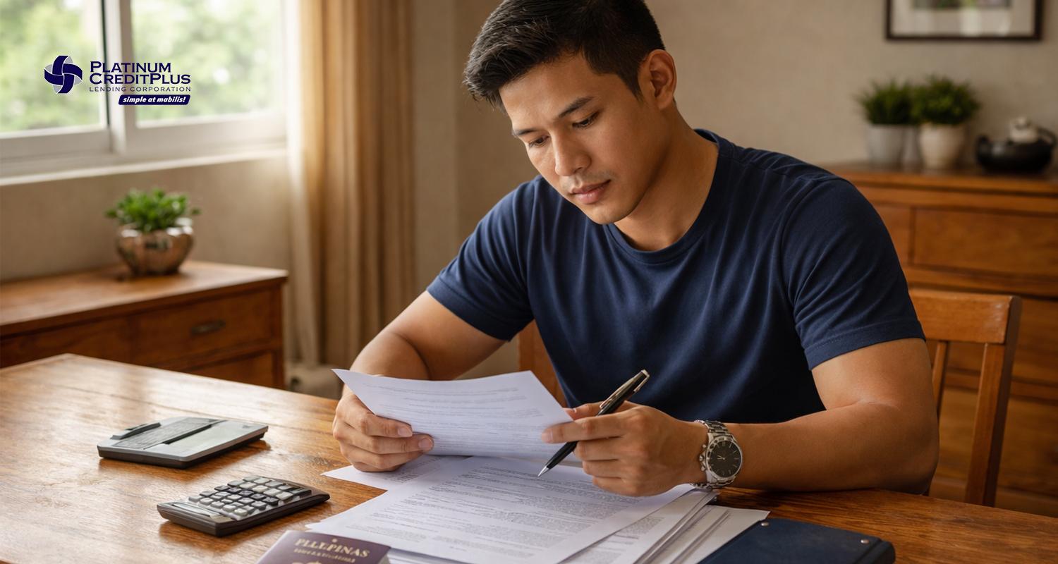 Filipino seafarer reviewing seaman's loan documents at home before deployment